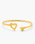 Gold bracelet with heart designs on a white background